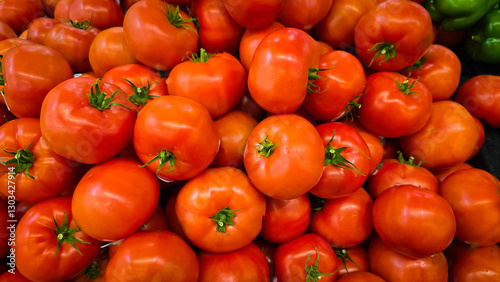colorful arrangement of fresh, ripe red tomatoes stacked together, showcasing their natural texture and vibrancy, perfect for culinary, market, or agricultural themes.
