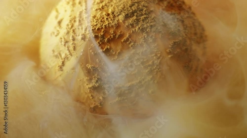 Ink spread. Watercolor fume. Dissolving powder orange swirl pigment color defocused round diamond water abstract texture background.