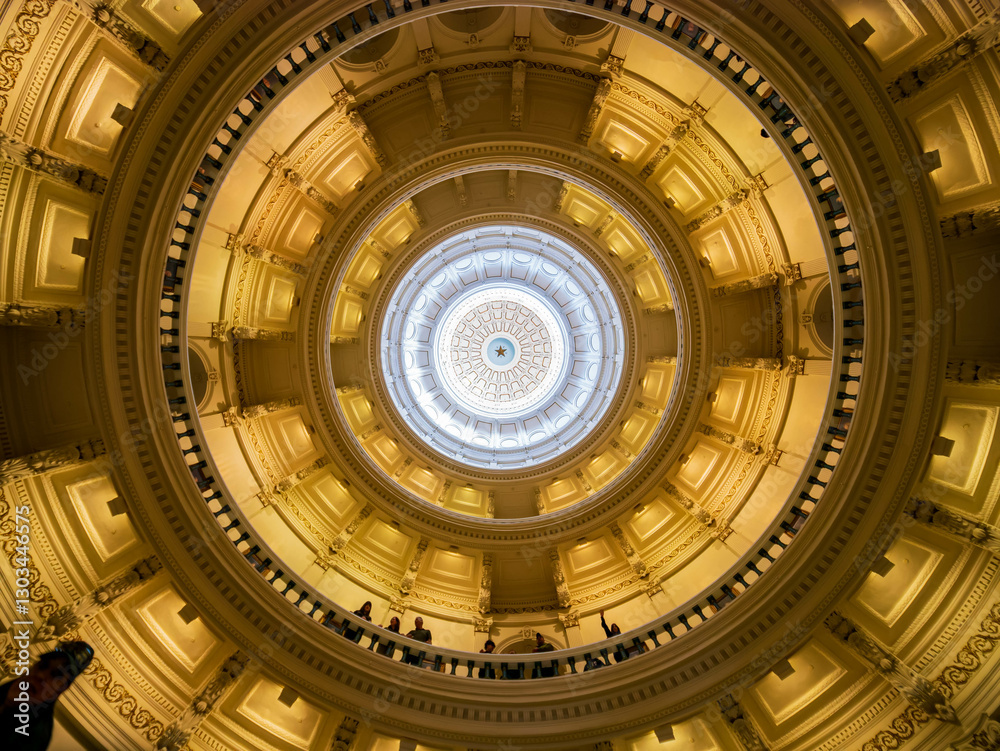 Interior view of the Texas Capitol with visitors exploring the halls.