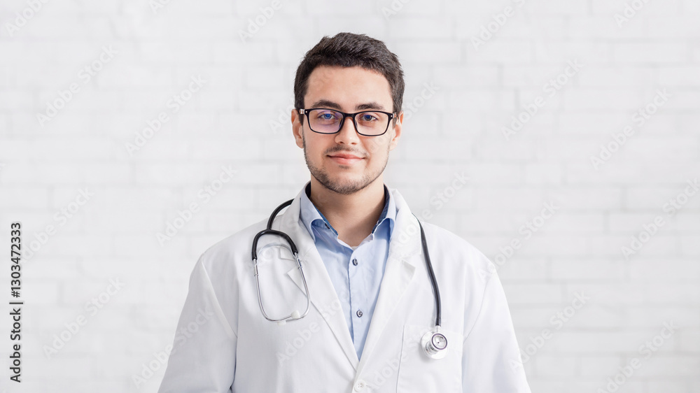 Online help and modern consultation remotely. Smiling male doctor in white coat and glasses, free space Online help and modern consultation remotely. Smiling male doctor in white coat and glasses, free space