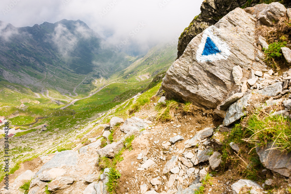 steep slope of fagaras ridge. mountain landscape of romania in summer. distant valley in clouds