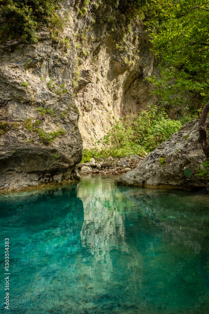 Crystal clear waters of natural springs and lake in the woods of the Mount Olympus, Greece