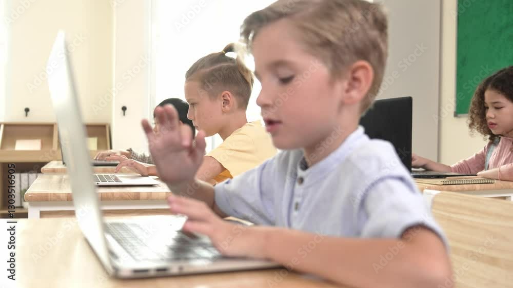 Caucasian smart child programing software system and learning about coding while multicultural searching about engineering code. Happy boy thinking about engineering prompt by using laptop. Pedagogy. Caucasian smart child programing software system and learning about coding while multicultural searching about engineering code. Happy boy thinking about engineering prompt by using laptop. Pedagogy.