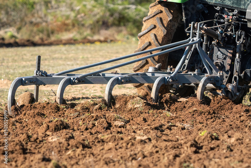 Fotografie A farmer ploughing his field