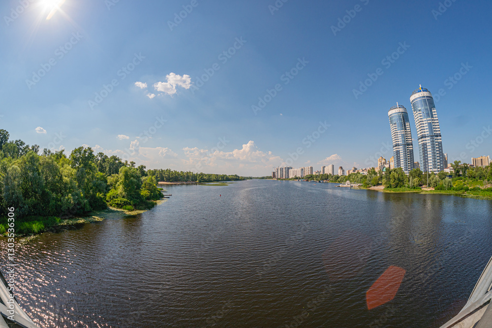 Naklejka premium A modern architectural structure with vertical columns, glass facade, and a riverfront setting is observed The design emphasizes transparency, resilience, and integration of - Kyiv, Ukraine 06-17-2024