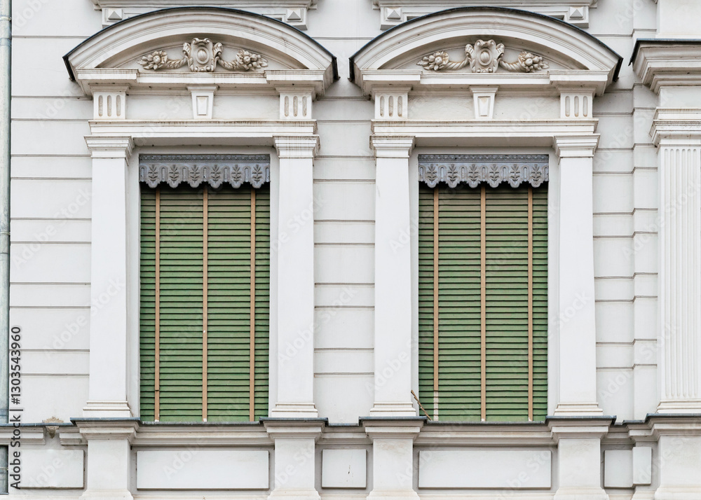 Beautiful old windows with closed shutters Beautiful old windows with closed shutters