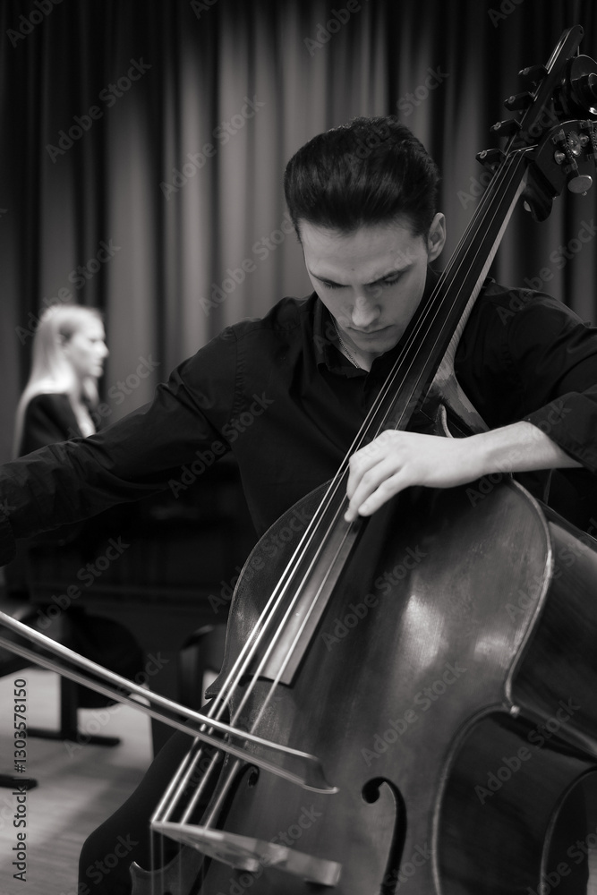 man playing a contrabass man playing a contrabass
