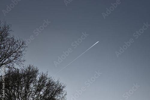 chem trail or contrail against a beautiful clear sky
