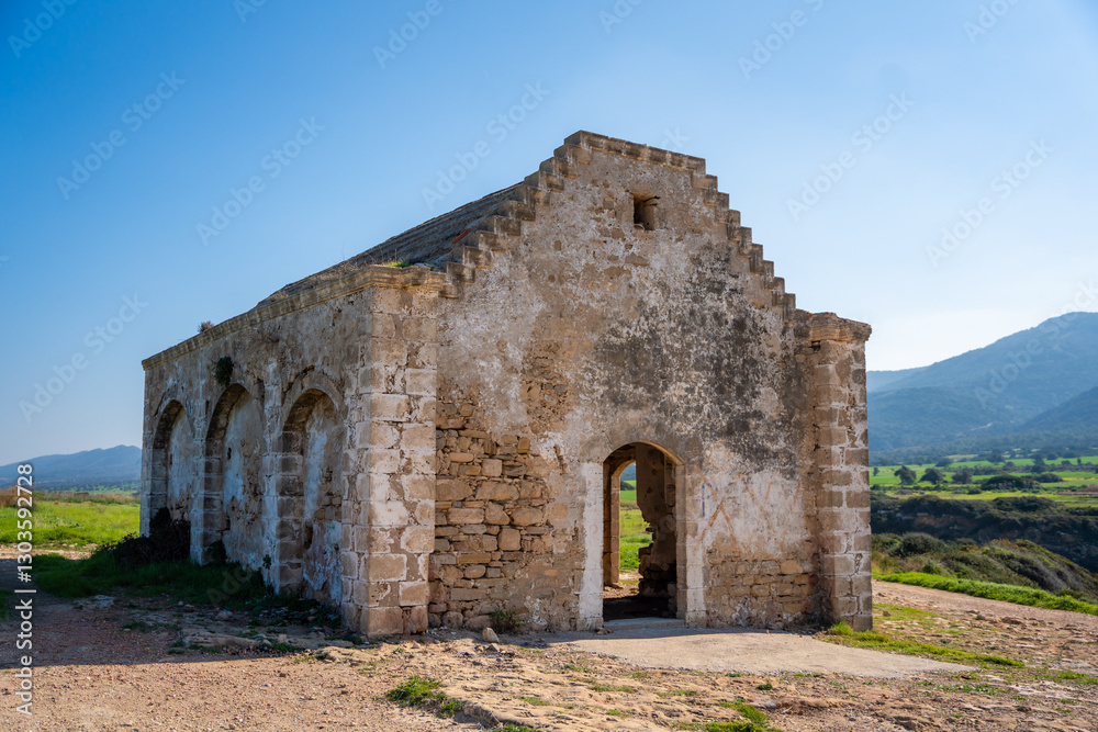 An old Orthodox church in ruins stands by the sea on the northern coast of Cyprus. The image reflects history, faith, and the passage of time in a coastal Mediterranean setting. An old Orthodox church in ruins stands by the sea on the northern coast of Cyprus. The image reflects history, faith, and the passage of time in a coastal Mediterranean setting.