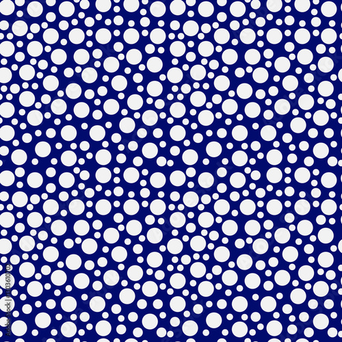 Seamless pattern of bright white polka dots on a blau background. 