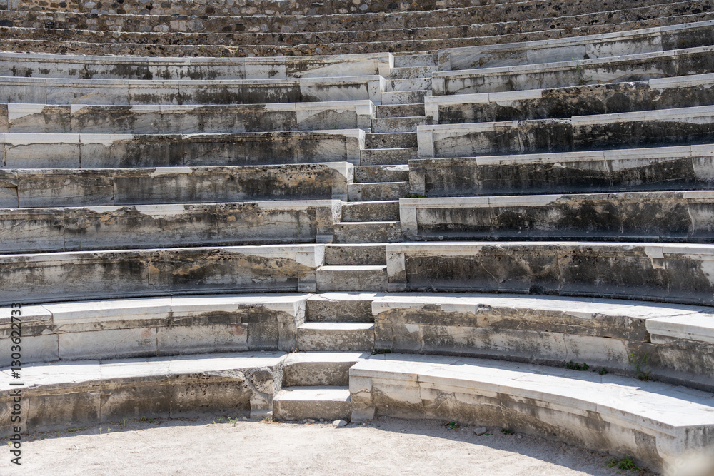Steps leading between the marble terrace seats in Roman Odeon amphitheater Steps leading between the marble terrace seats in Roman Odeon amphitheater