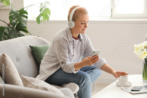 Young woman in headphones w...