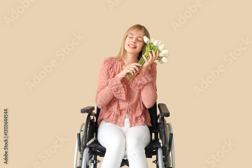 Young woman in wheelchair w...
