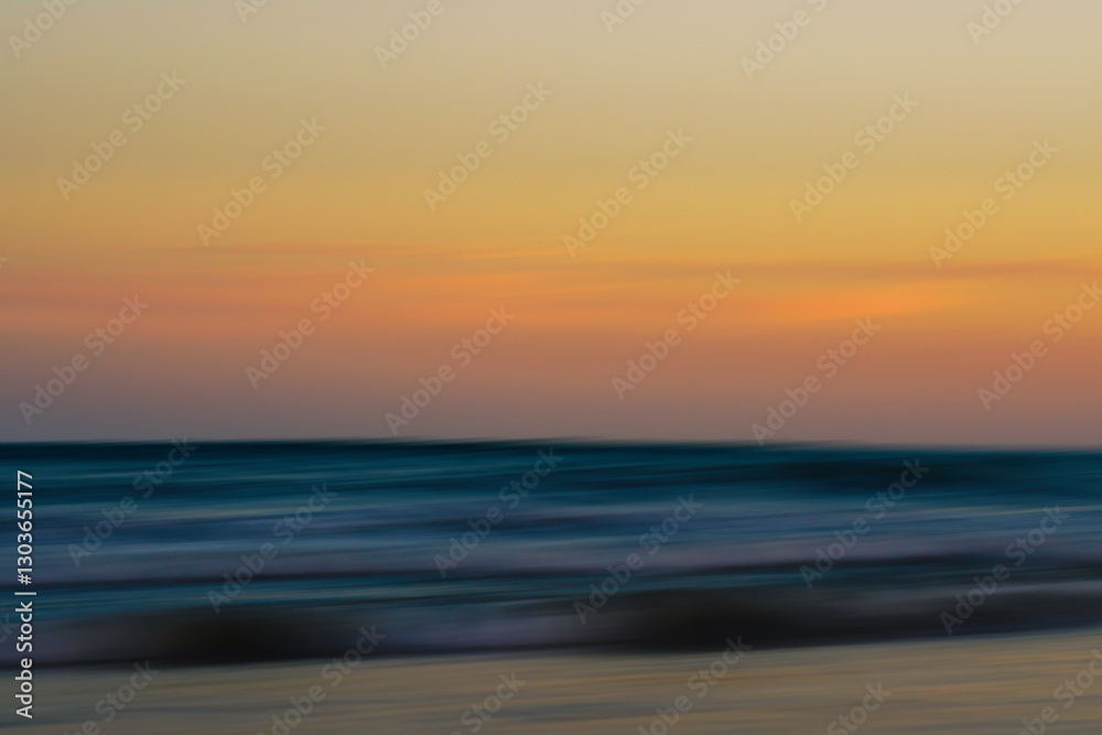 Obraz premium Flowing waves and soft colors blend to create a dreamy seascape.