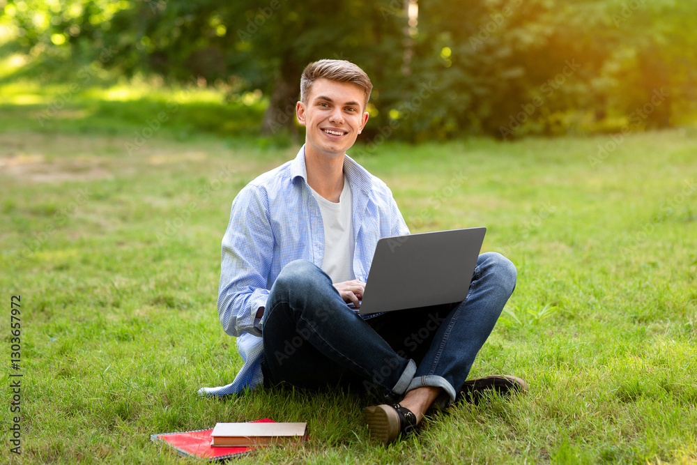 Online Jobs For College Students. Smiling Young Guy Working On Laptop Outdoors, Looking At Camera, Sitting On Lawn In Park, Copy Space Online Jobs For College Students. Smiling Young Guy Working On Laptop Outdoors, Looking At Camera, Sitting On Lawn In Park, Copy Space