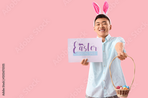 Young Asian man in bunny ea...