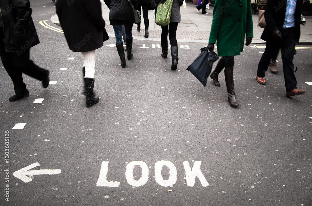 London crosswalk London wiht look sign on pavement London crosswalk London wiht look sign on pavement
