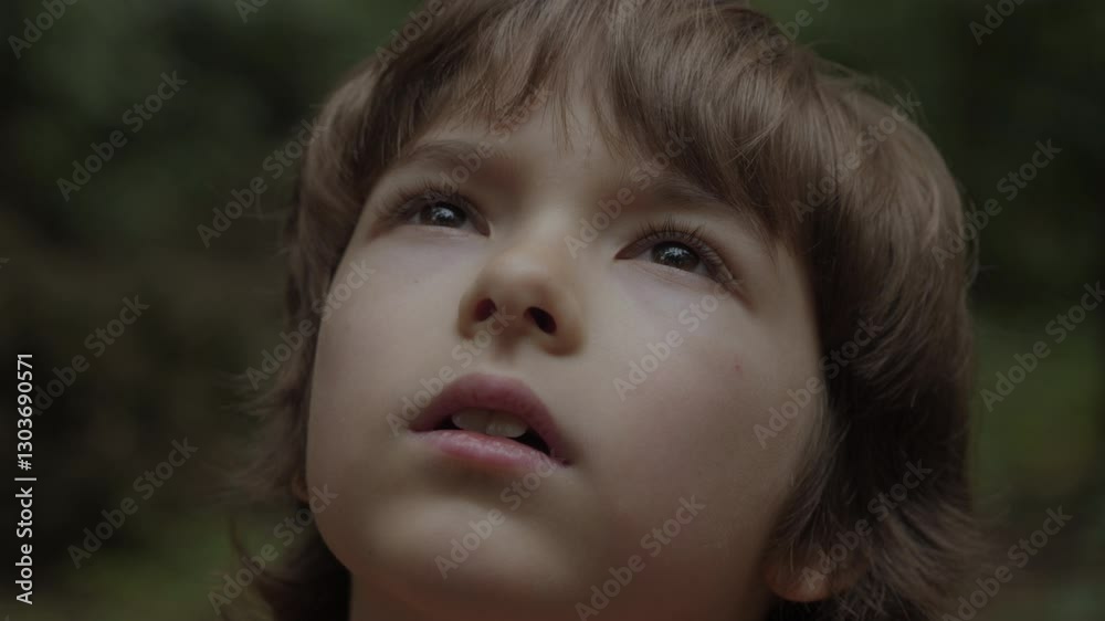 Little Boy Looks Upwards With Curiosity in Nature Outdoors. Close-up Eyes of Child Looking Up Thoughtfully. Boy Looks-up God Believer Prayer, Passionate Dreamer. Child Looking Up at Sky in Nature. Little Boy Looks Upwards With Curiosity in Nature Outdoors. Close-up Eyes of Child Looking Up Thoughtfully. Boy Looks-up God Believer Prayer, Passionate Dreamer. Child Looking Up at Sky in Nature.