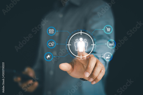 Businessman touch on screen to target customer. Target customer, buyer persona, customer behavior concept. Marketing plan and strategies. Personalization marketing, customer centric strategies.