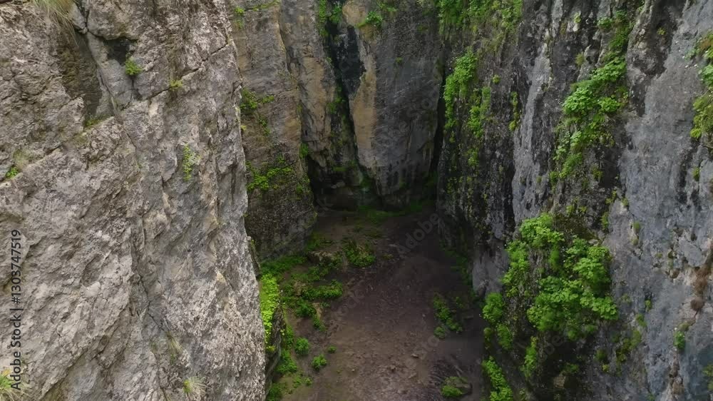 Aerial view of Maltas Canyon, Dagestan, showcasing a vast valley with steep mountain walls, resembling locations used in Hollywood movie scenes. Aerial view of Maltas Canyon, Dagestan, showcasing a vast valley with steep mountain walls, resembling locations used in Hollywood movie scenes.