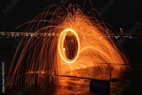 Fire rings and sparks created with red-hot steel wool.