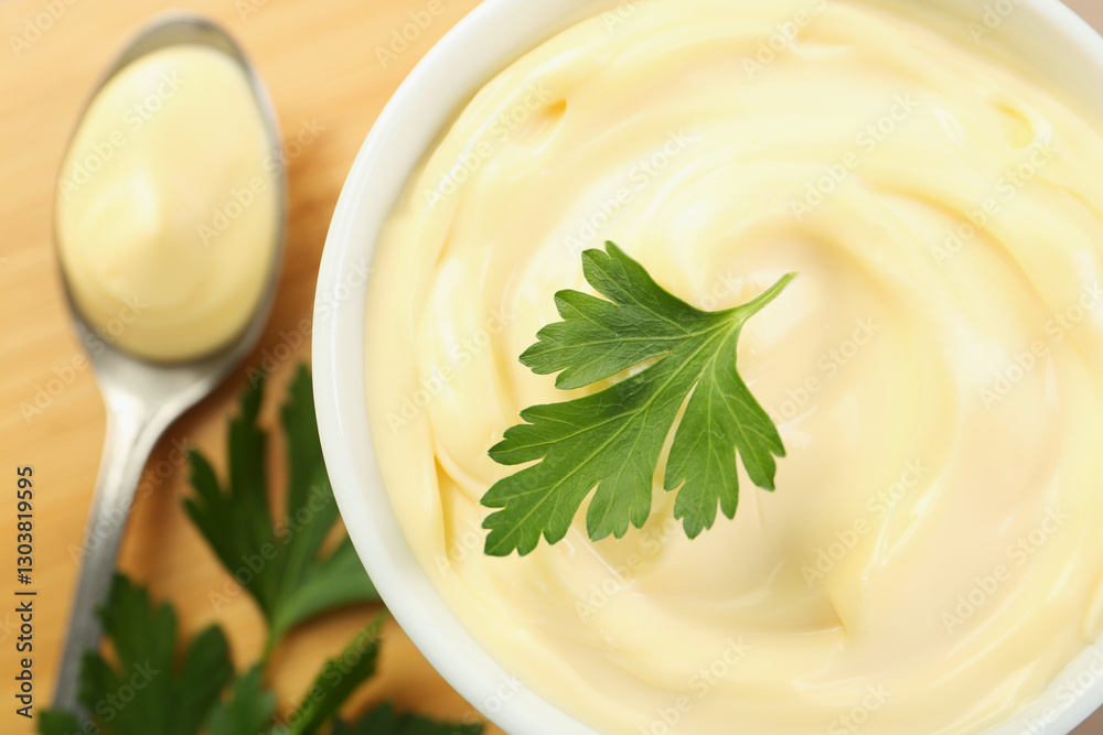 Delicious mayonnaise sauce with parsley in bowl on table, top view Delicious mayonnaise sauce with parsley in bowl on table, top view