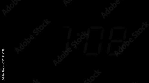Digital timer displaying zero hours and minutes in a dark setting