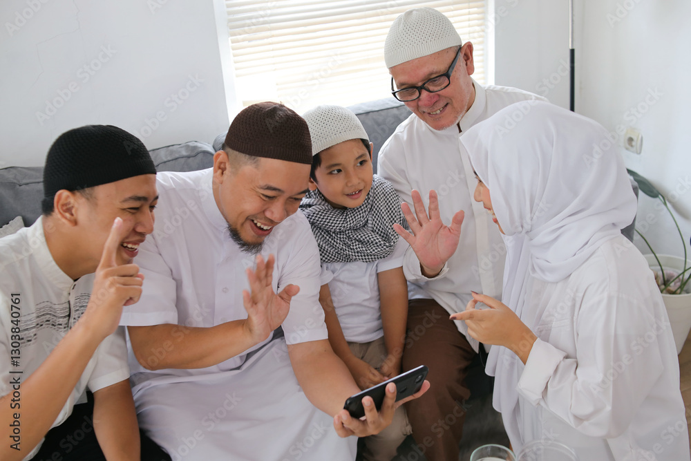 Fototapeta premium Multi Generation Muslim People Talking On Video Call With Family Members To Forgive Each Other During Eid Celebration