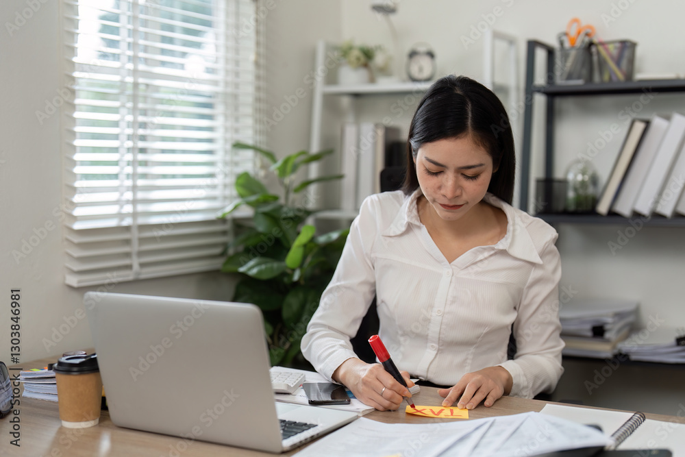 Accountant taking notes and organizing financial data in the office. Accountant taking notes and organizing financial data in the office.