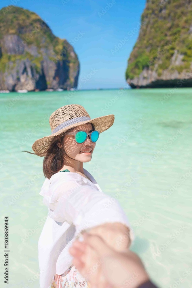 Couple tourist traveling and sightseeing in Krabi, Thailand. happy traveller enjoy at Maya Bay beach on Phi Phi island. Honeymoon trip, destination, Southeast Asia Travel, vacation and holiday concept Couple tourist traveling and sightseeing in Krabi, Thailand. happy traveller enjoy at Maya Bay beach on Phi Phi island. Honeymoon trip, destination, Southeast Asia Travel, vacation and holiday concept