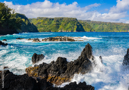 Waves Washing Against The Jagged Lava Spires in Nua' Ailua Bay, Keanae, Maui, Hawaii, USA photo