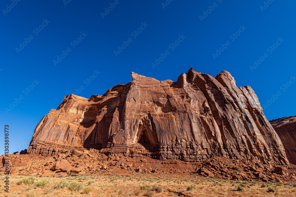 Beautiful Monument Valley seen from Monument Valley Scenic Drive. The drive is a 17-mile loop on a rough dirt road in the valley. Beautiful Monument Valley seen from Monument Valley Scenic Drive. The drive is a 17-mile loop on a rough dirt road in the valley.