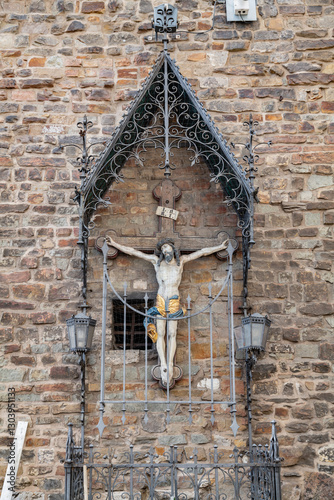 A crucifix framed in a Gothic iron structure photo