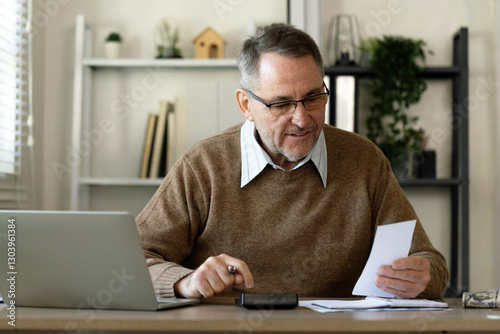 concept of budget planning, retirement lifestyles and financial responsibility or spending. retirement savings,old elderly seniors holding paper bills using a calculator to calculate expenses at home.