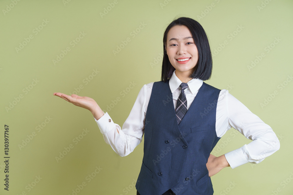 Professional young woman in formal attire showcasing confidence and friendliness indoors Professional young woman in formal attire showcasing confidence and friendliness indoors