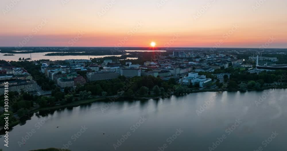 Hyperlapse drone shot of a colorful sunset above the Toolo cityscape in Helsinki Hyperlapse drone shot of a colorful sunset above the Toolo cityscape in Helsinki
