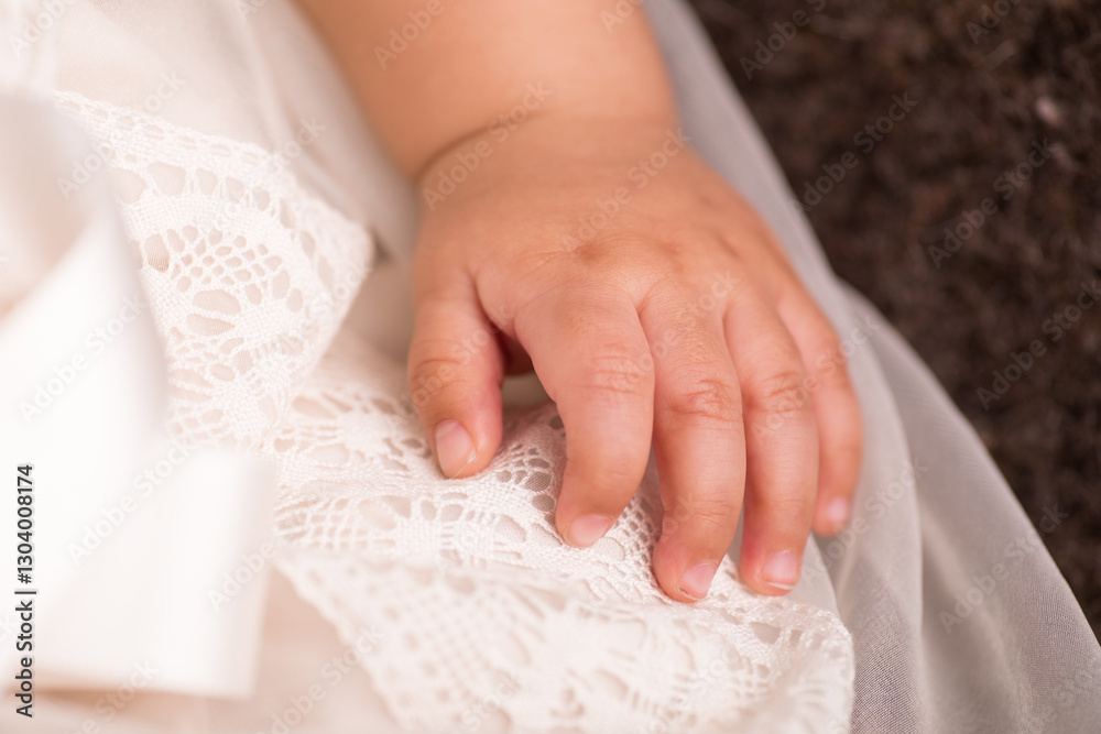 Newborn baby human little fingers and hands being held close up Newborn baby human little fingers and hands being held close up
