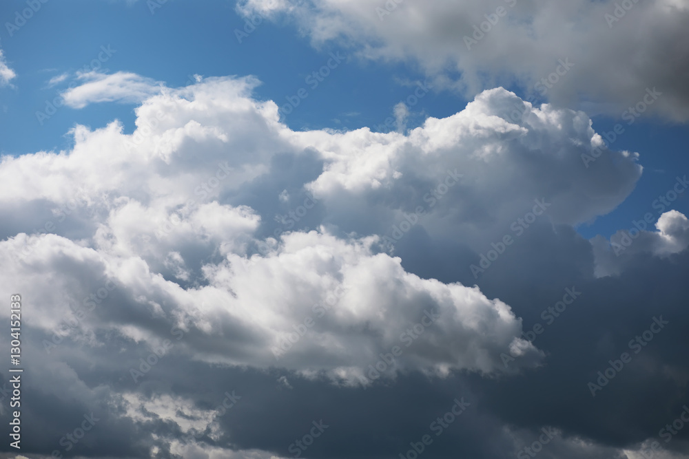 Fluffy White Clouds in Blue Sky with Dark Shadows, Natural Weather Photography