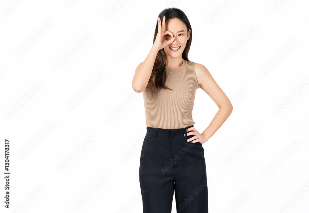Portrait of happy Asian woman shows ok sign and looking at the camera on white background. Portrait of happy Asian woman shows ok sign and looking at the camera on white background.