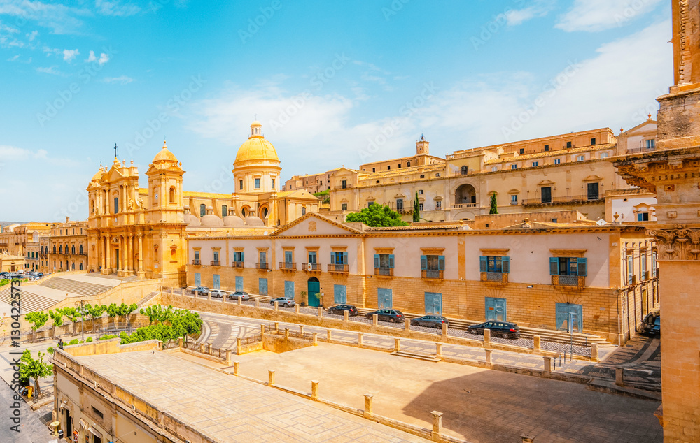 Fototapeta premium view in Noto, with the Basilica Minore di San Nicolo and Palazzo Ducezio, Sicily, Italy. Chiesa di Santa Chiara.