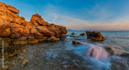 Obraz na płótnie Beautiful sunrise on the wild, rocky bay of Zakynthos island w salonie