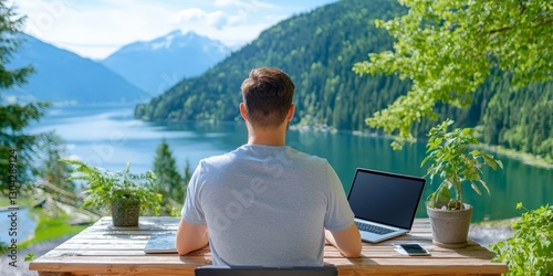 a digital nomad working on a laptop in a scenic outdoor landscape photo