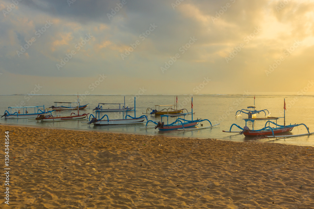 Sanur beach is a coastal stretch of beach east of Denpasar in southeast Bali, and a lot of traditional fishing boats(spider boat), is one of the famous tourist beaches on the island of Bali Sanur beach is a coastal stretch of beach east of Denpasar in southeast Bali, and a lot of traditional fishing boats(spider boat), is one of the famous tourist beaches on the island of Bali