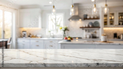 Modern kitchen scene with a prominent polished marble countertop, featuring white and grey veining and a blurred background, ideal for showcasing countertop materials