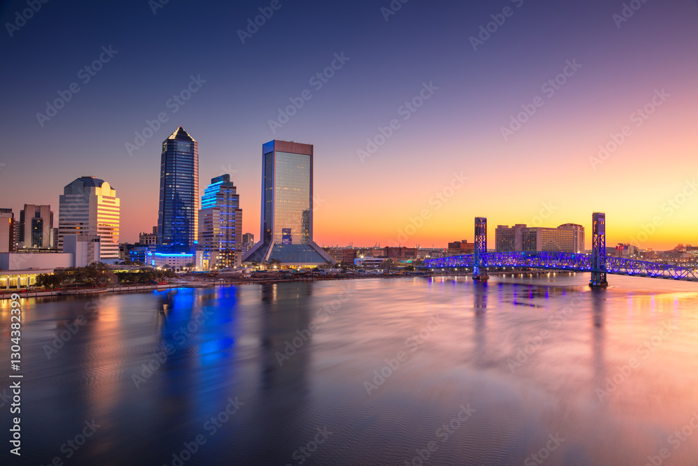 Jacksonville, Florida, USA. Cityscape image of Jacksonville, Florida with reflection of the city skyline in the water at beautiful sunrise.