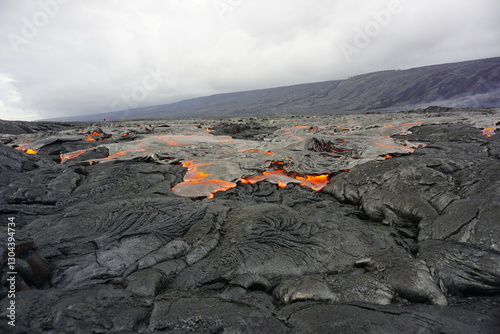 Hot magma flows  over old lava field
