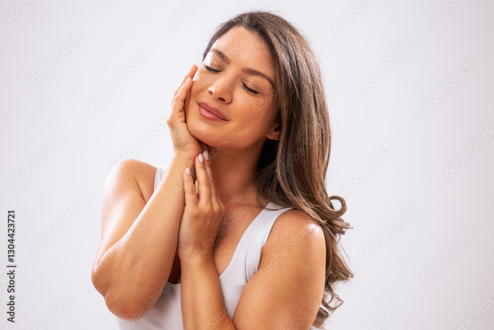 Portrait of adult woman who is satisfied with her skin. Portrait of adult woman who is satisfied with her skin.