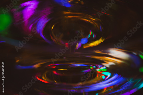 Obraz na płótnie Abstract multicolour background. New Year lights. Blurred colourful light on champagne glass. Rainbow flash in dark. Futuristic shiny background. Illuminated effect. Bright glowing. w salonie