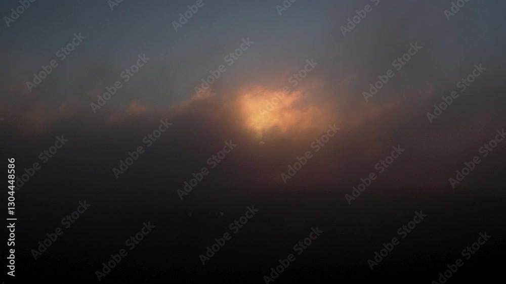 Aerial: foggy fire sky sunrise with forest and cloudscape, establishing drone shot Aerial: foggy fire sky sunrise with forest and cloudscape, establishing drone shot