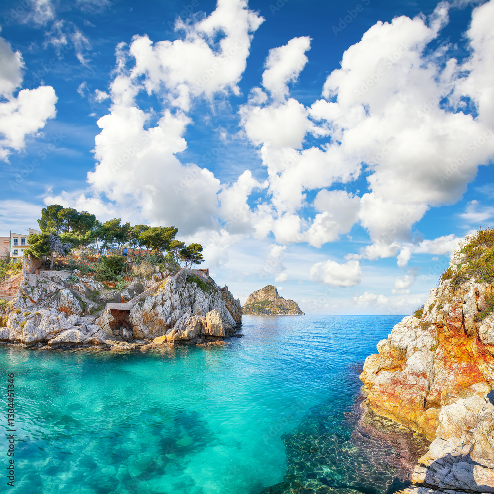 Spectacular summer view of Santa Flavia town and cape Zafferano on background.
